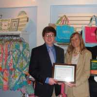 <p>Dr. Christine Hamilton Hall, center, and Zachary Decker, right, present a Young Scientist Award to Austin McLaughlin, a senior at Darien High School.</p>