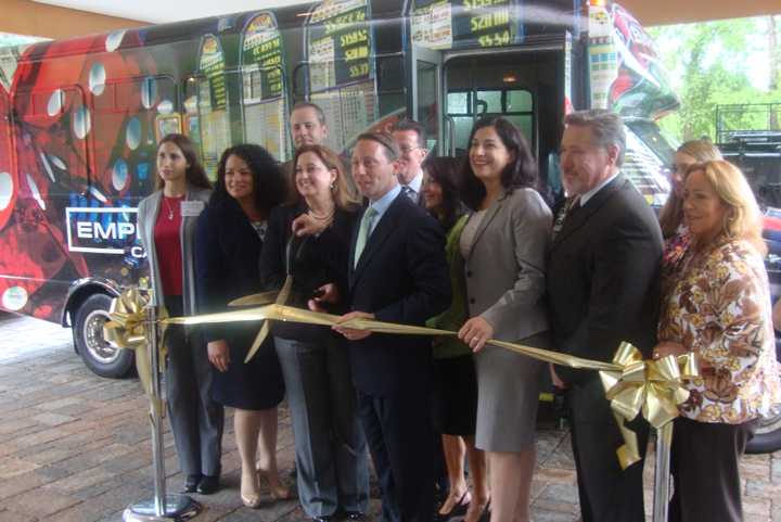 Officials celebrate a new free shuttle service that will take guests from 12 Westchester hotels to the Empire City Casino in Yonkers.