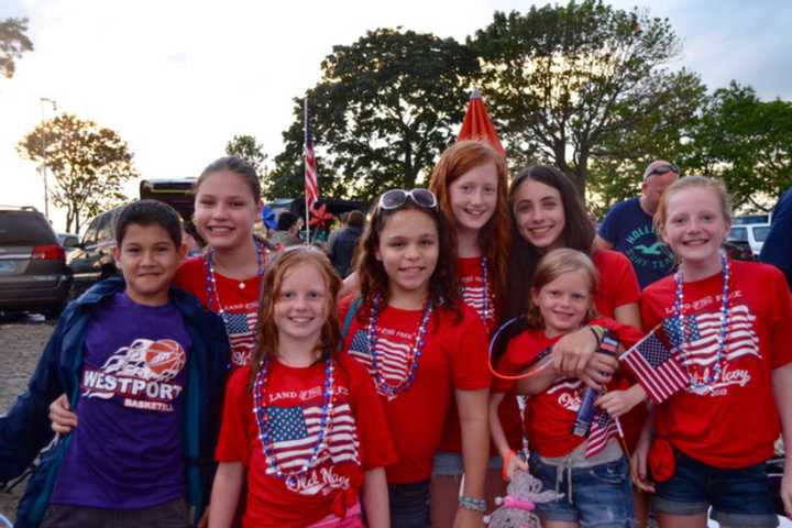 A patriotic group of fireworks fans in Westport enjoy Independence Day celebrations.