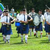 <p>A bag pipe band performs at the Round Hill Highland Games at Cranbury Park in Norwalk on Saturday.</p>