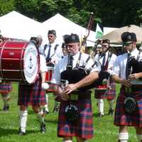 <p>A bag pipe band performs Scottish songs Saturday at the annual Round Hill Highland Games at Cranbury Park in Norwalk.</p>