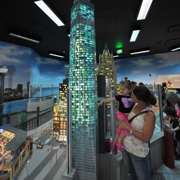 Guests at LEGOLAND Discovery Center Westchester watch a LEGO replica of One World Trade Center light up following a special ceremony unveiling the model last month.