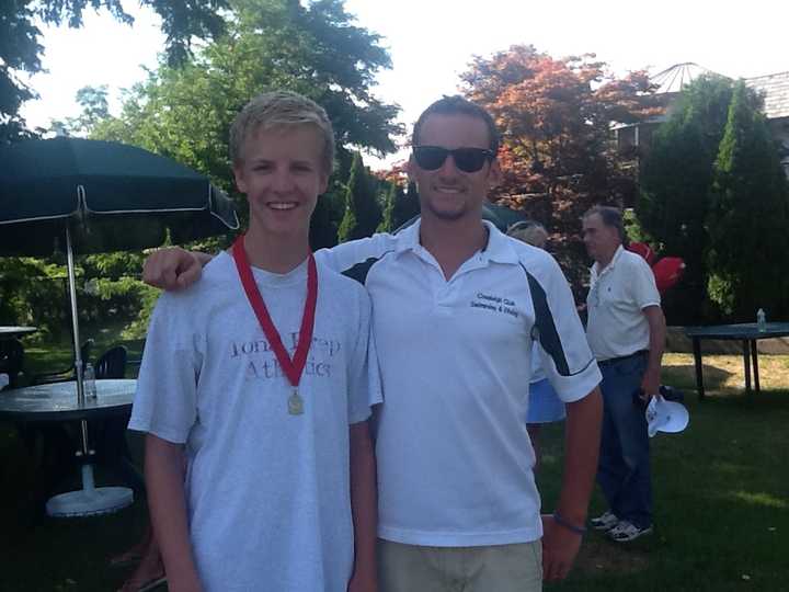 Grant Dalton, pictured with his diving Coach Nick Turner, placed second at the Westchester Diving Championships.