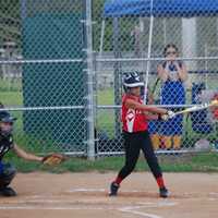 <p>Samantha Juthnas gets a hit as part of a complete team performance by Fairfield.</p>