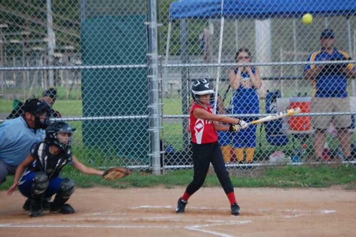 Samantha Juthnas gets a hit as part of a complete team performance by Fairfield.