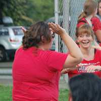 <p>Fairfield fans Katie Romeo and Amy Keary celebrate another run.</p>