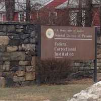 <p>Only the signs are visible from the road for the Federal Correctional Institution in Danbury. </p>