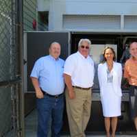 <p>Tuckahoe Facilities Manager Bill Williams, Mayor Steve Ecklond, Assemblywoman Amy Paulin and Trustee Greg Luisi in front of the generator. </p>