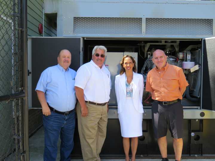 Tuckahoe Facilities Manager Bill Williams, Mayor Steve Ecklond, Assemblywoman Amy Paulin and Trustee Greg Luisi in front of the generator. 