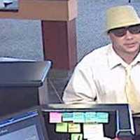 <p>This is a surveillance camera photo of the suspect in the bank robbery in Greenwich. </p>