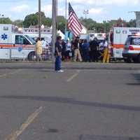 <p>An injured child is put into an ambulance Sunday at the Norwalk Oyster Festival. Most of the children injured in a ride malfunction were treated at the scene. </p>