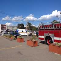 <p>Emergency vehicles gather at the scene of a ride malfunction at the Norwalk Oyster Festival. A total of 13 children were injured. </p>