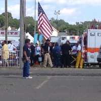 <p>An injured child is loaded into an ambulance Sunday at the Norwalk Oyster Festival. </p>