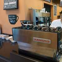 <p>Ridgefield resident Han Lee prepare a beverage at his coffee shop and cafe, Coffee Story, in Wilton. </p>