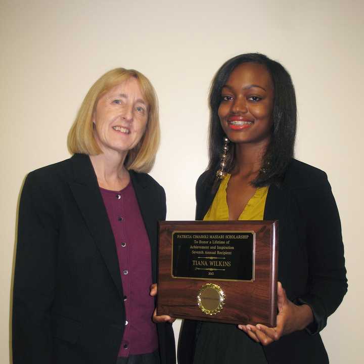 Berkeley College Provost Marianne Vakalis, presents Tiana Wilkins of Ossining with the 2013 Massari Scholarship.