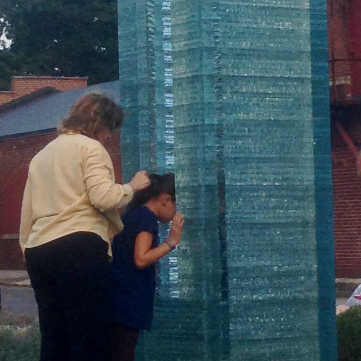 Friends of a Sept. 11 victim pay an up-close visit to Danbury&#x27;s memorial before the ceremony Wednesday evening. 