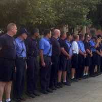 <p>Danbury&#x27;s firefighters line up as the police honor guard makes its way up Main Street for the city&#x27;s annual 9-11 ceremony. </p>