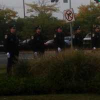 <p>Members of the Danbury Police Honor Guard prepare for the rifle salute at the service. </p>