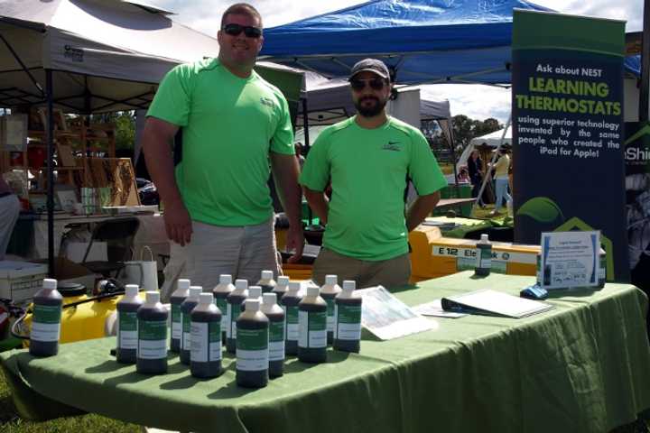 Paul Melancon and Timothy Hidu of Sea Green Organics sell their seaweed-based fertilizer at the Live Green Connecticut Festival in Norwalk on Saturday. The festival continues on Sunday.