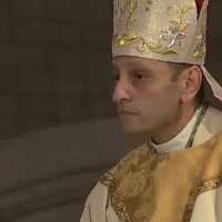 <p>Bishop Frank J. Caggiano takes his place at the front of St. Theresa Roman Catholic Church in Trumbull before the Mass begins. </p>