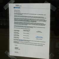 <p>The notice placed on the doors of the former downtown post office building in Stamford to alert people of the closing.</p>