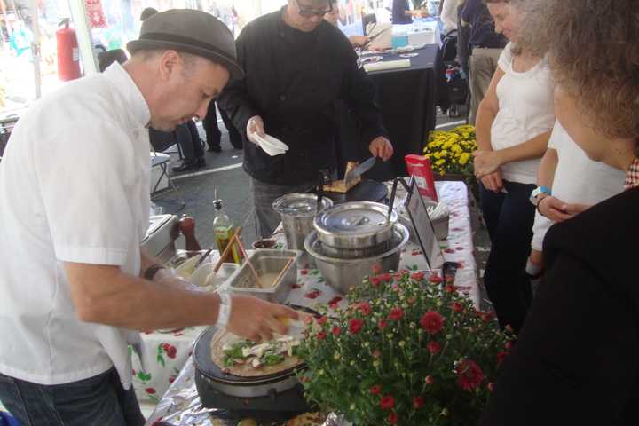 Westchester residents line up to get custom crepes from Grenadine French Creperie at the Southern Westchester Food and Wine Festival in Scarsdale.