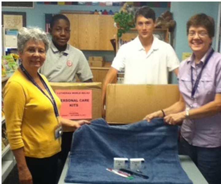 The relief kits are ready to be shipped. From left to right, Nelly Palumbo, Justin Trotman, Alex Kirchgaesser, and Sharon Peterson