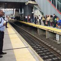 <p>Metro-North commuters line the Stamford train platform</p>