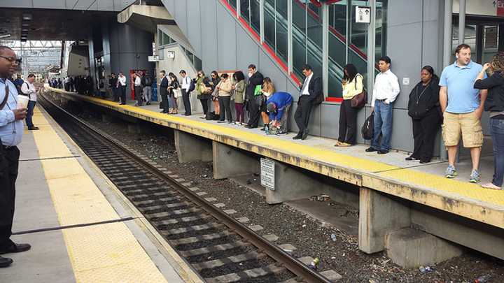 Metro-North commuters line the Stamford train platform