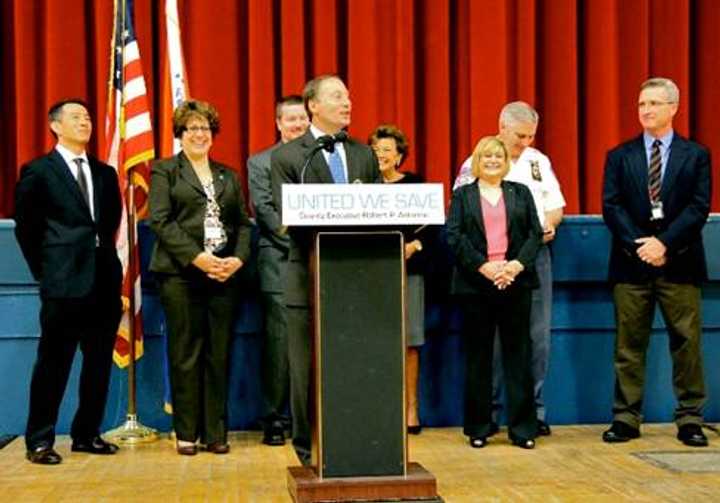 County Executive Robert P. Astorino (center) kicks off the United We Save Shared Municipal Services Expo 13. 