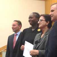 <p>A new citizen poses with County Executive Rob Astorino, Justice Janet Malone and County Clerk Timothy Idoni.</p>