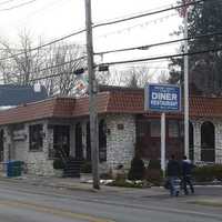 <p>The newspaper racks in front of the Mount Kisco Coach Diner are at the center of the dispute between rivals newspapers The Examiner and Hudson Valley Reporter.</p>