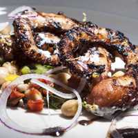 <p>Octopus, which is served with a Mediterranean chickpea salad ($13). 
</p>