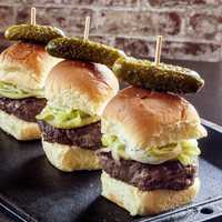 <p>Gyro sliders served with spicy pepperoncini and onion ($10).</p>