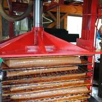 <p>The apple puree is put into blankets, to be pressed into juice. Cole Thompson, now 4, stands with dad, Ian Thompson, at his father&#x27;s cider mill.</p>