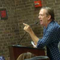 <p>A Harrison parent yells at New York Education Commissioner John King about the Common Core at a public forum held in Port Chester Monday.</p>