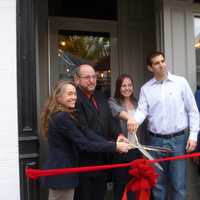 <p>Ossining officials and owners Steven and Jessica Vescio celebrate the grand opening of Keenan House.</p>