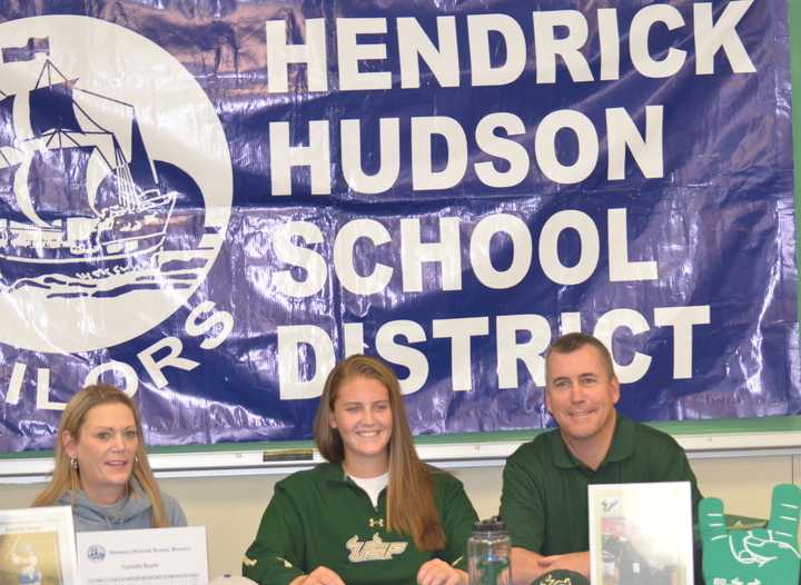 Cassidy Boyle with her parents, Rick and Karen Boyle after signing a National Letter of Intent to play at the University of South Florida.