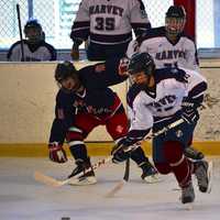 <p>Harvey&#x27;s Keith Lambert controls the puck against Stepinac.</p>