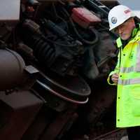 <p>NTSB investigator Michael Flanigon inspects track at the scene of the Metro-North train derailment in the Bronx on Sunday. </p>