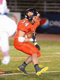 Ridgefield Football Takes On Top-Seeded Newtown In Playoffs