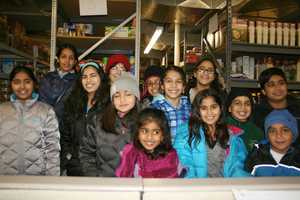 Children Fill Bags With Food For Operation Hope In Fairfield