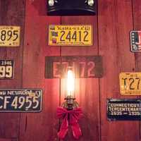 <p>A collection of vintage license plates decorate the walls of the Little Barn in Westport.</p>