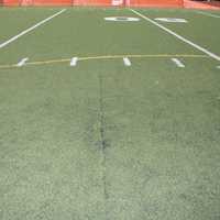 <p>Exposed seams have created a safety concern on the synthetic turf field at the Eastchester High School.</p>