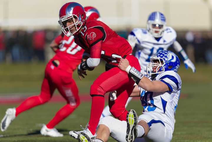 Darien and New Canaan will meet for the Class L state football title at Boyle Stadium in Stamford. The game was moved Thursday due to a weather forecast.