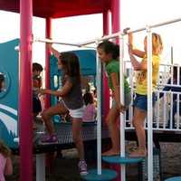 <p>Children get their first chance to play at Fairfield&#x27;s playground in September in honor of Sandy Hook victim Jessica Rekos. Photo </p>