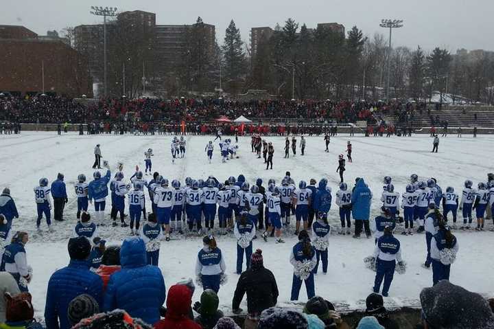 New Canaan beat Darien Saturday at snowy Boyle Stadium in Stamford the Class L football championship.