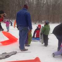 <p>Kids and adults enjoy sledding in Darien&#x27;s Baker Park Saturday afternoon.</p>