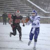 <p>Darien quarterback Silas Wyper looks for a receiver.</p>