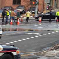 <p>Several lanes are blocked as water from a burst main floods the intersection of Arch Street and Railroad Avenue in Greenwich.</p>